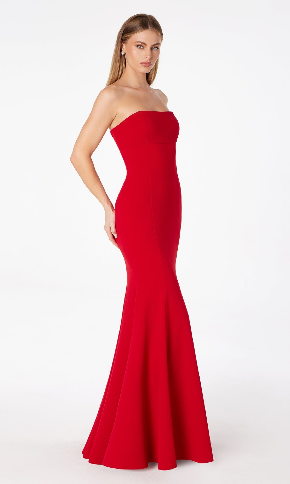 A woman models the Astee T2010 Lace-Up Strapless Long Prom Dress—fitted, floor-length, and vibrant red—against a white background. This budget-friendly gown offers an elegant silhouette for any special occasion.